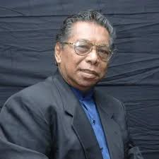 Abdul Rahman Abu Bakar creating a traditional kite